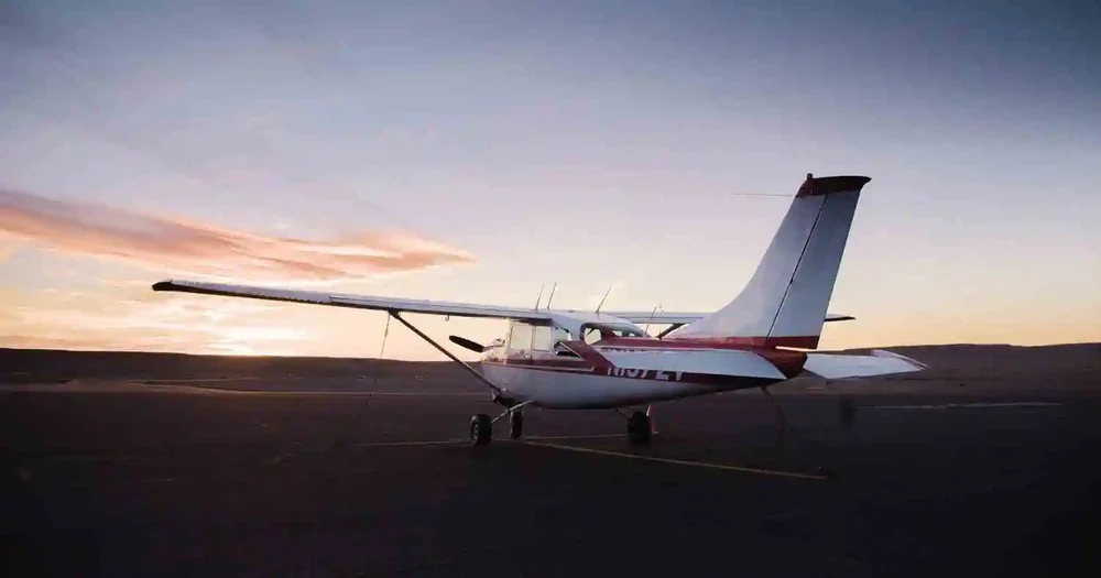 Pilot coordinating with a passenger and ATC during a cross-country flight.