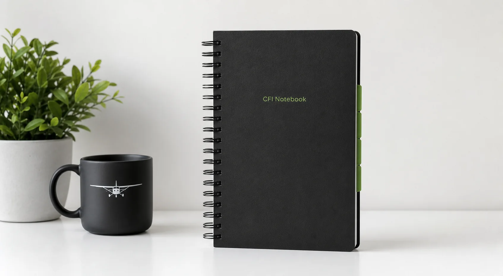 CFI Notebook, aviation mug, and plant